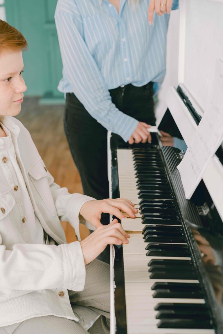 Piano teacher teaching a lesson